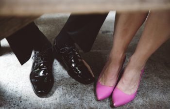 a photo of black shoes and pink shoes