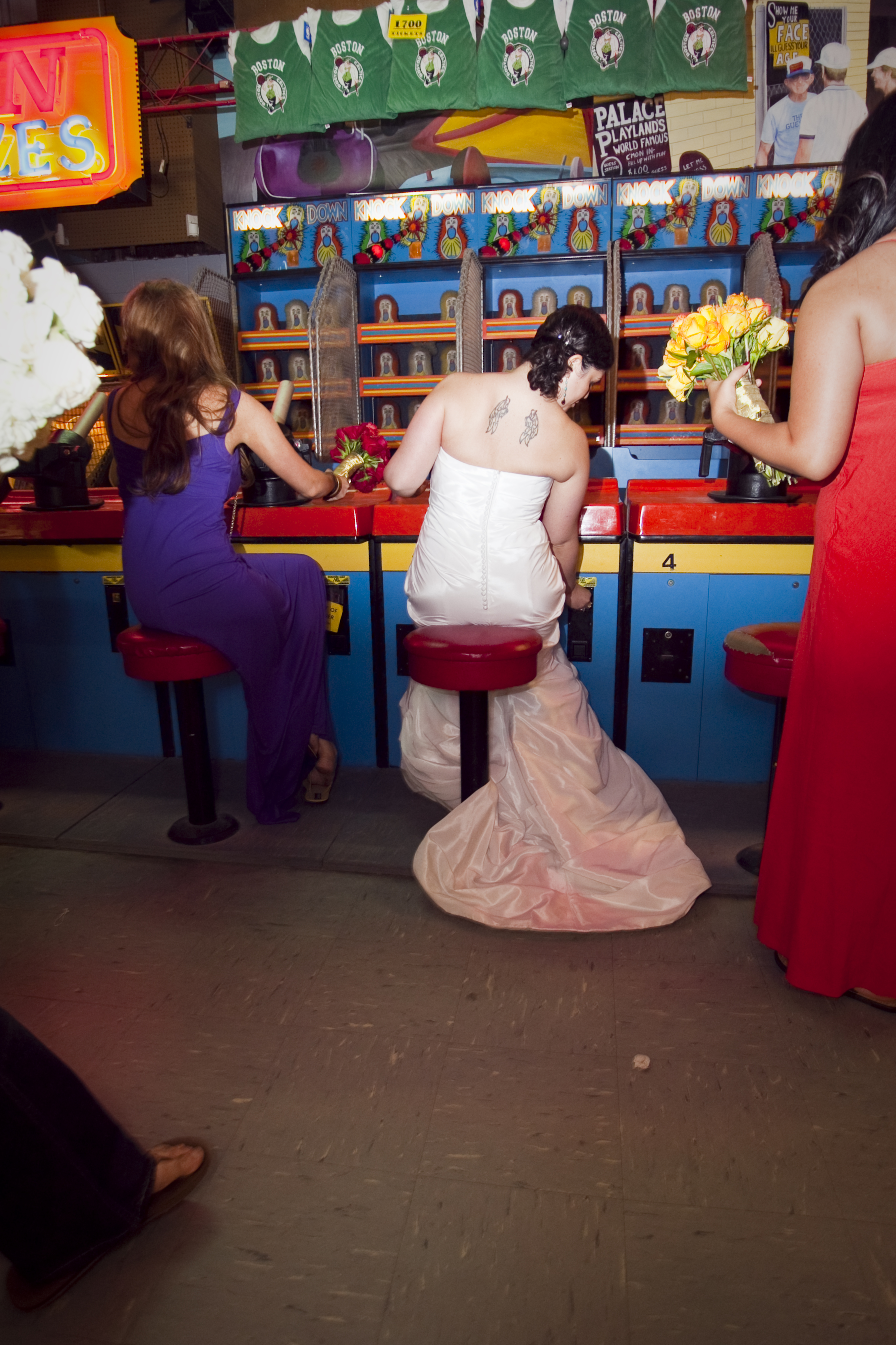 A bride sits on a bar stool