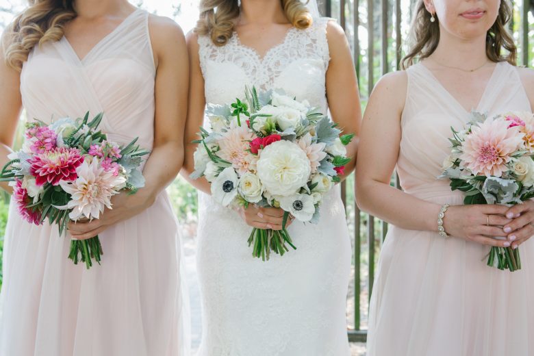 bride and bridesmaids with flowers