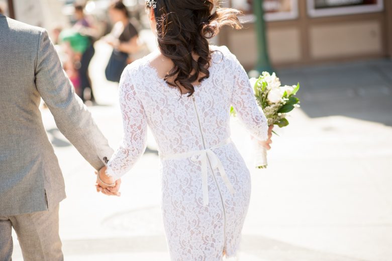 back of bride walking away