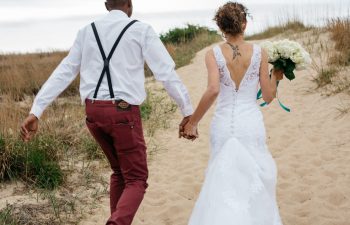 bride and groom walking away together