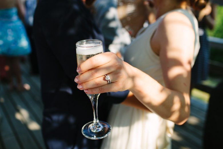 woman holding glass of champagne