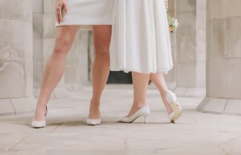 two brides standing together