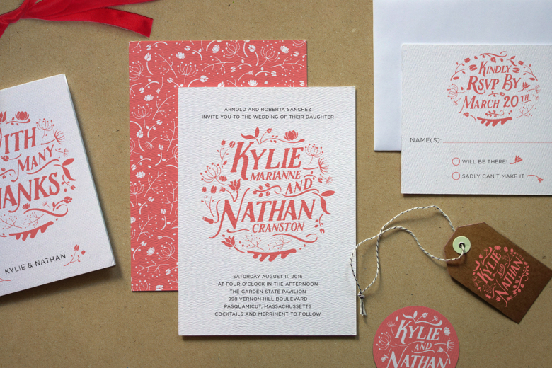 white wedding invitations with flowery red type