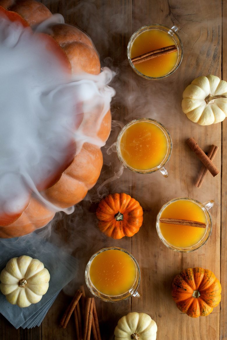 halloween26 - A giant pumpkin spilling dry ice makes a spooky Halloween punch bowl. - Photo credit: HonestlyYUM (can also be used on wire)