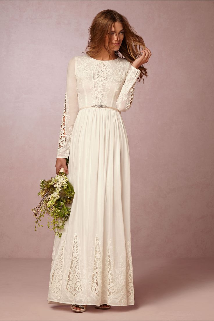 Long-sleeved white lace wedding dress from BHLDN. | A Practical Wedding