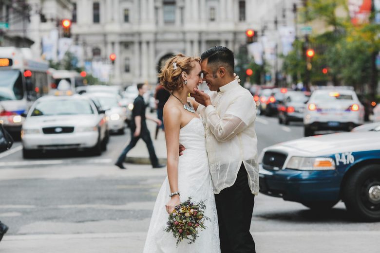 man and woman in street on wedding day