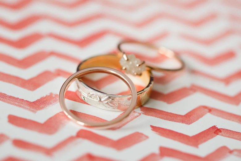 wedding rings on pink and white