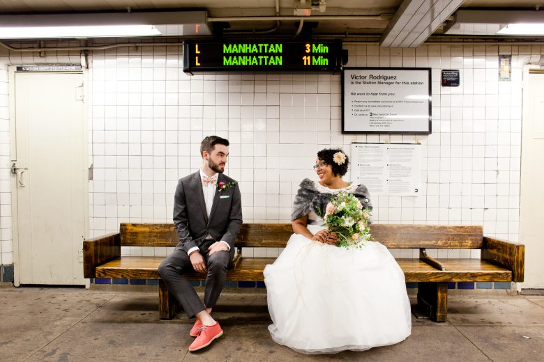 bride and groom waiting for the subway
