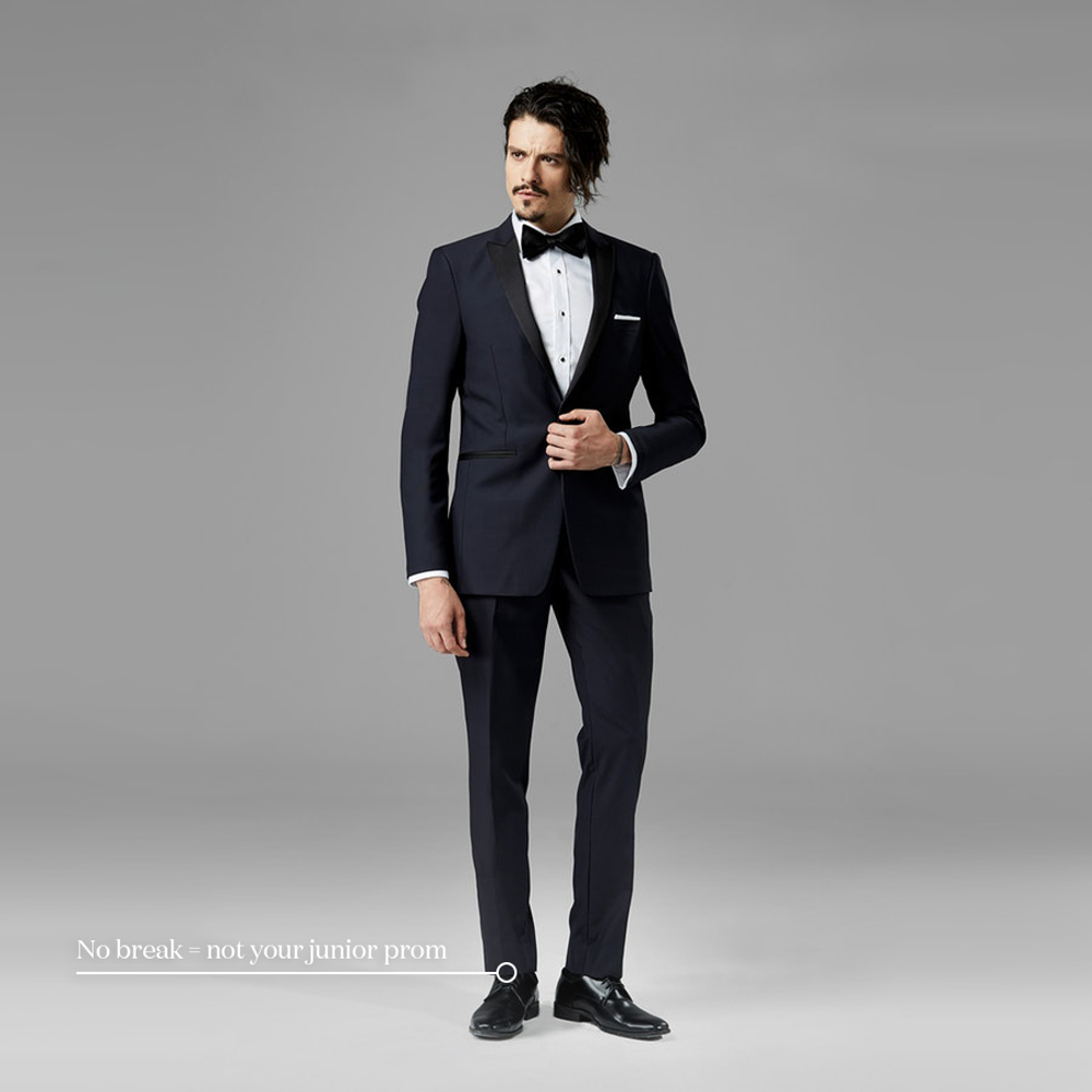 a graphic image depicts a wedding suit with no pant break from generation tux