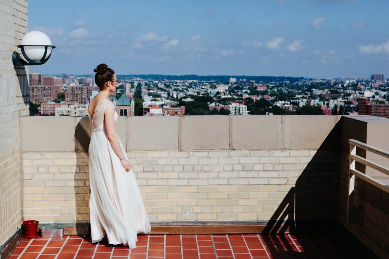 bride standing on rooftop