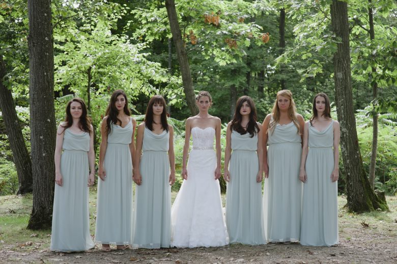 Bridesmaids wearing teal bridesmaids dresses by Dessy