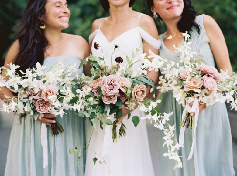 photo of bride standing with bridesmaids