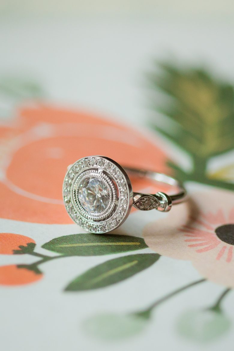 Vintage inspired engagement ring on floral paper