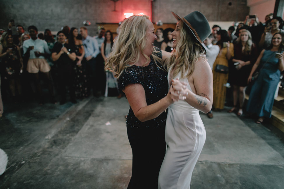 a bride dances with her mother during the reception