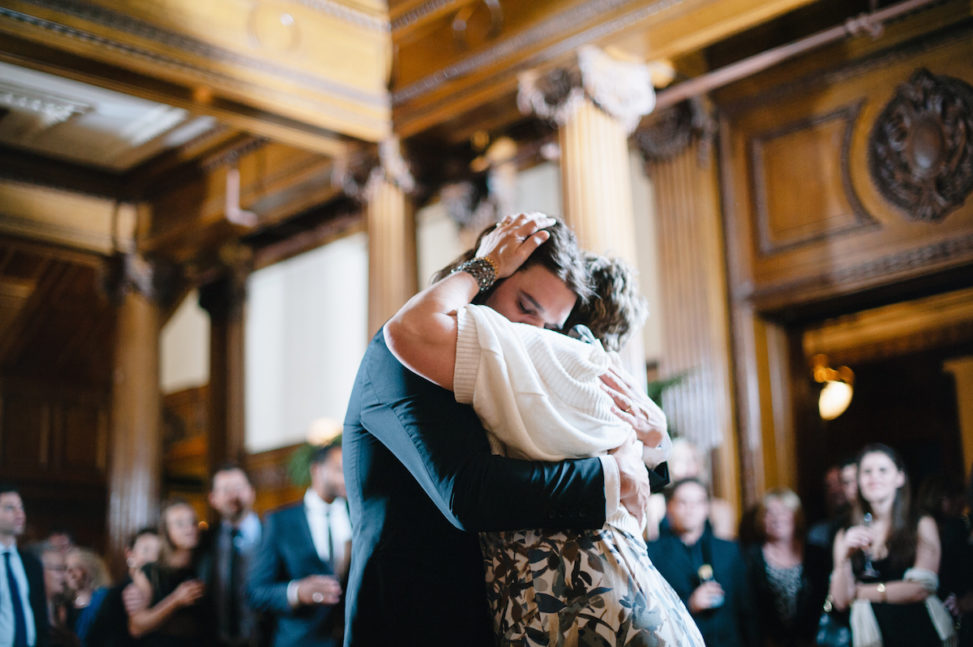 a groom dances with his mother