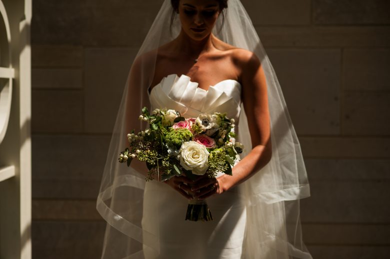 bride standing in shadows