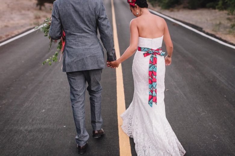 bride and groom walking on the road