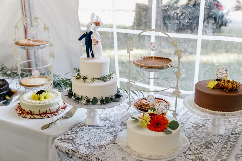 wedding cakes and pie on dessert table