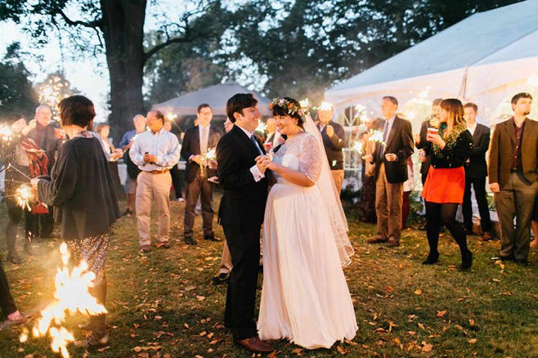 bride and groom dancing in sparklers