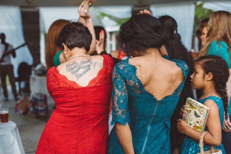 tattooed ladies in lace dresses dancing