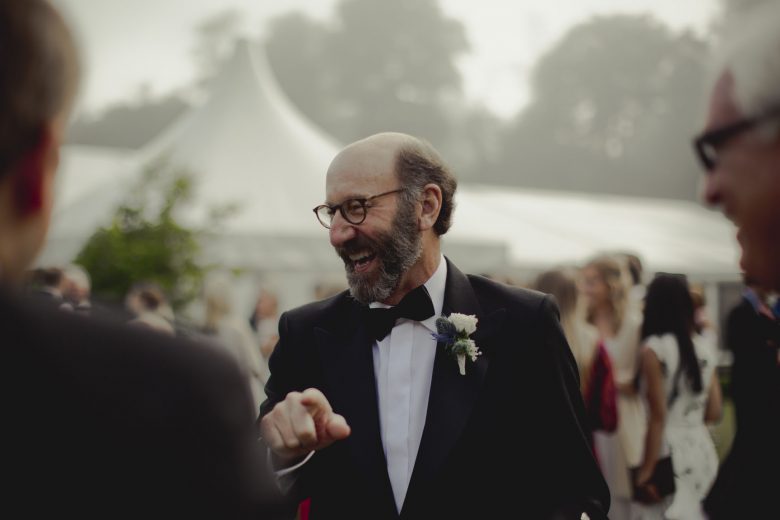 wedding guest laughing at wedding