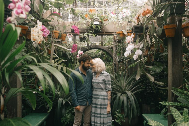 couple smiling in a conservatory