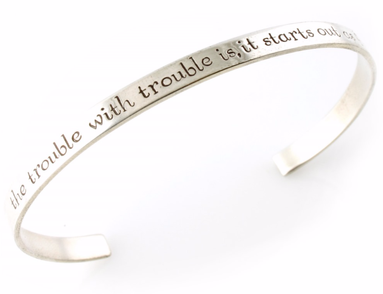 silver cuff with words on it