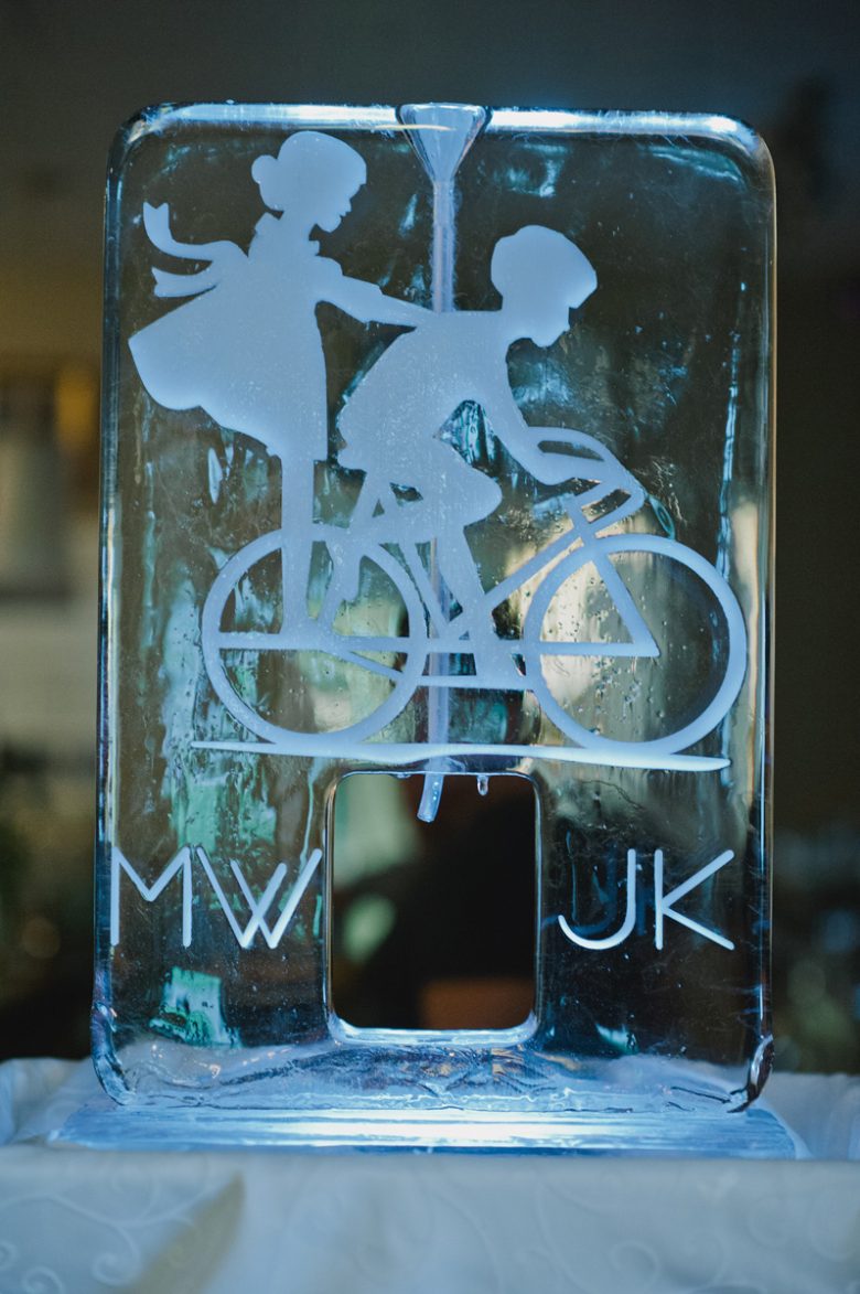 ice sculpture of bride and groom on bikes