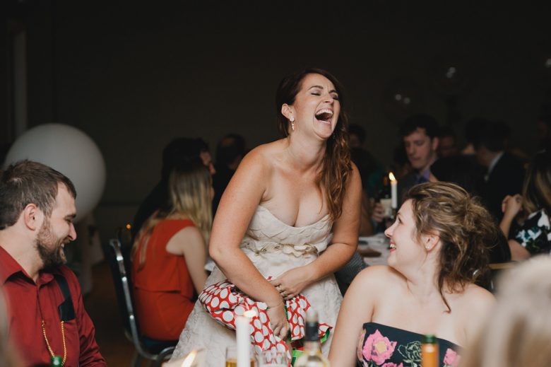 bride laughing with guests
