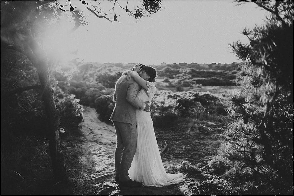 A bride and groom embrace in the wilderness in a black and white photo by Shaw Photography Co.
