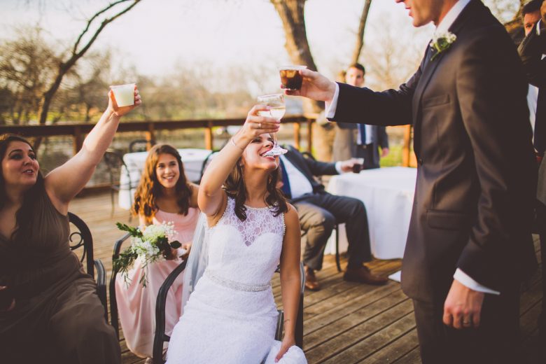 Photography by Kelley Raye bride and groom toasting