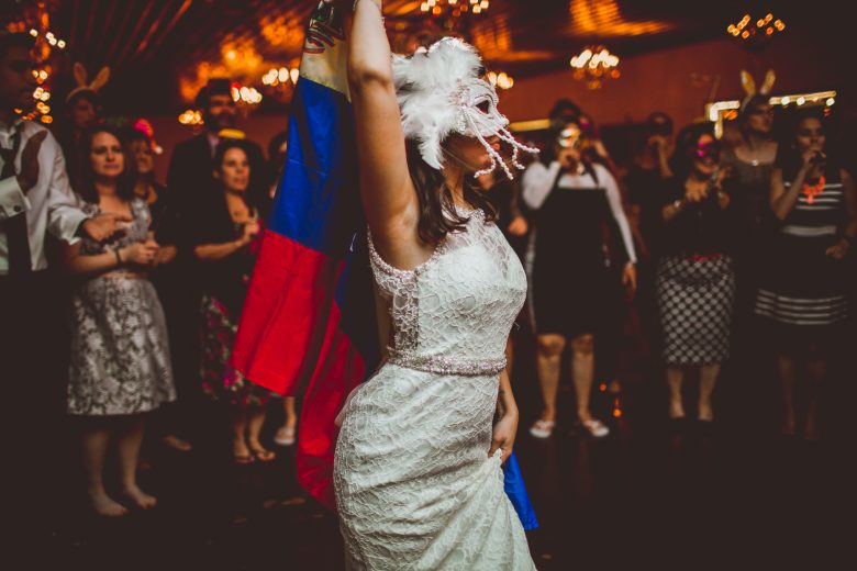 Kelly Raye Photography bride dancing with mask