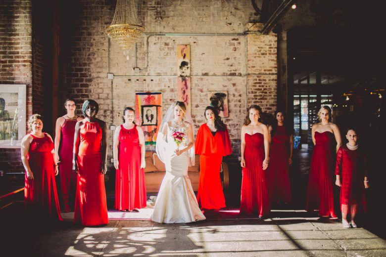 bridemaids in red with bride in center
