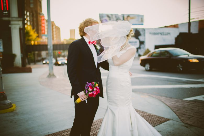 Photography by Kelley Raye bride and groom covered by veil