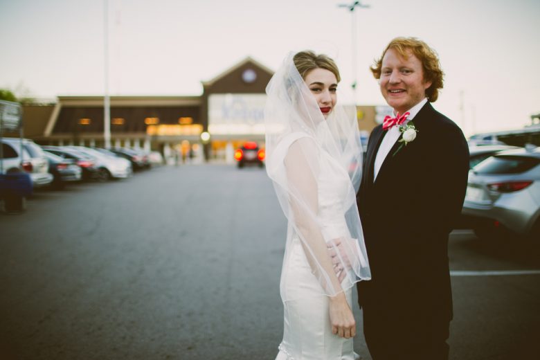 Kelly Raye Photography bride and groom in parking lot