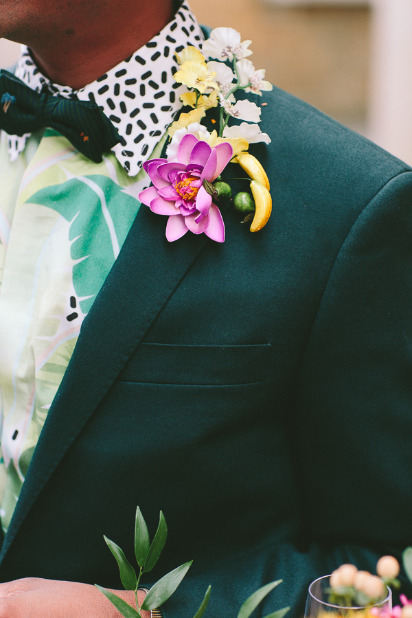 tropical flowers on groom