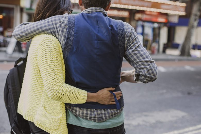 couple standing together on the street