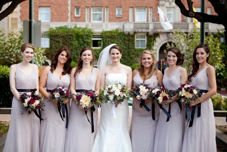 Bridesmaid in purple wtoo dresses
