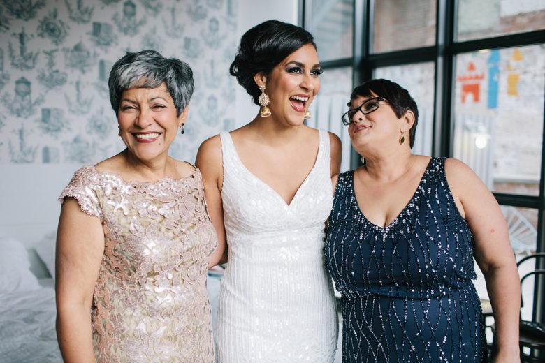 bride with guests wearing lace and sequins