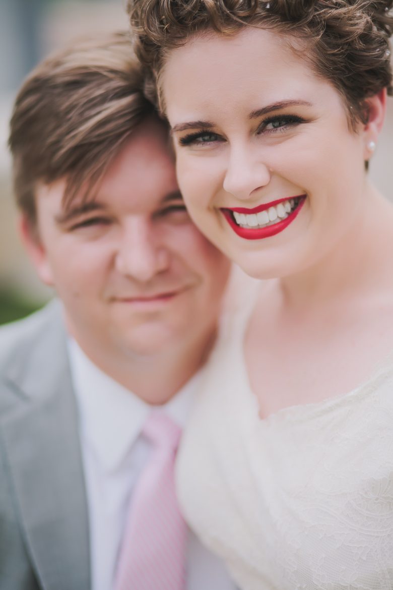 bride with red lipstick and groom