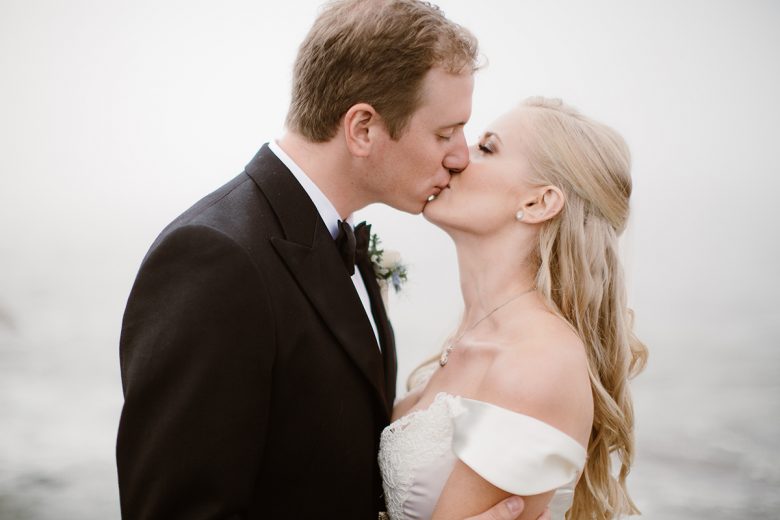 blond bride and groom kissing
