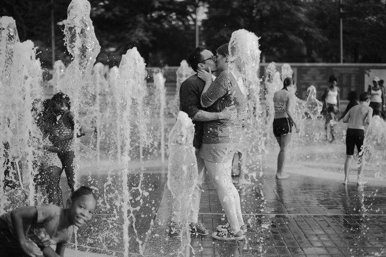 couple kissing in fountain