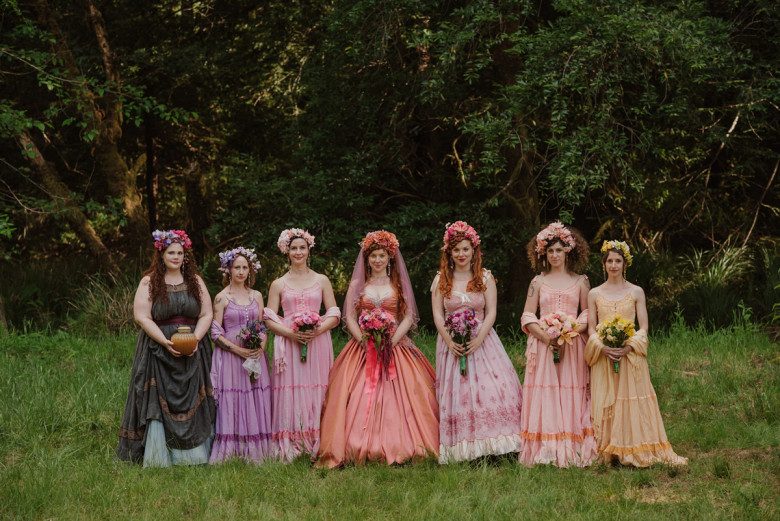 rainbow bridesmaids with curly briesmaids hairstyles and flower crowns