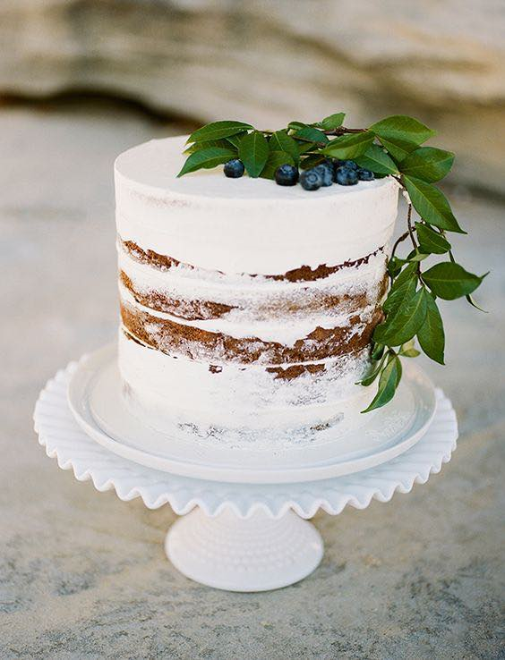 minimalist white cake with berries