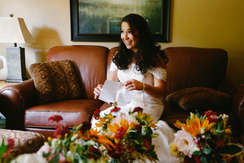 bride sitting on sofa smiling