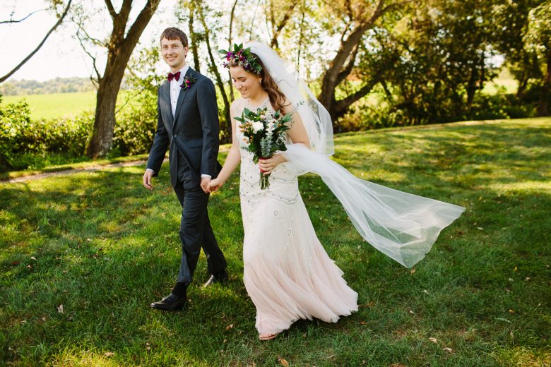groom and bride with flower crown and veil