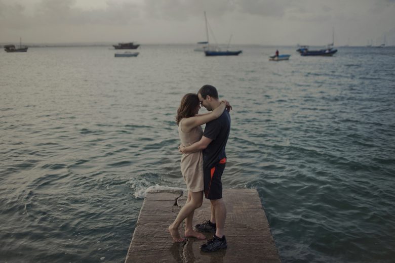 couple standing on a pier