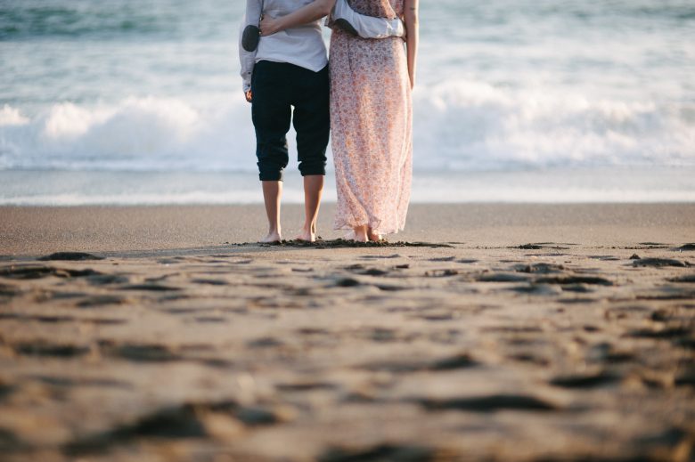 couple standing together at the beach