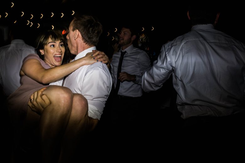man and woman dancing at a wedding